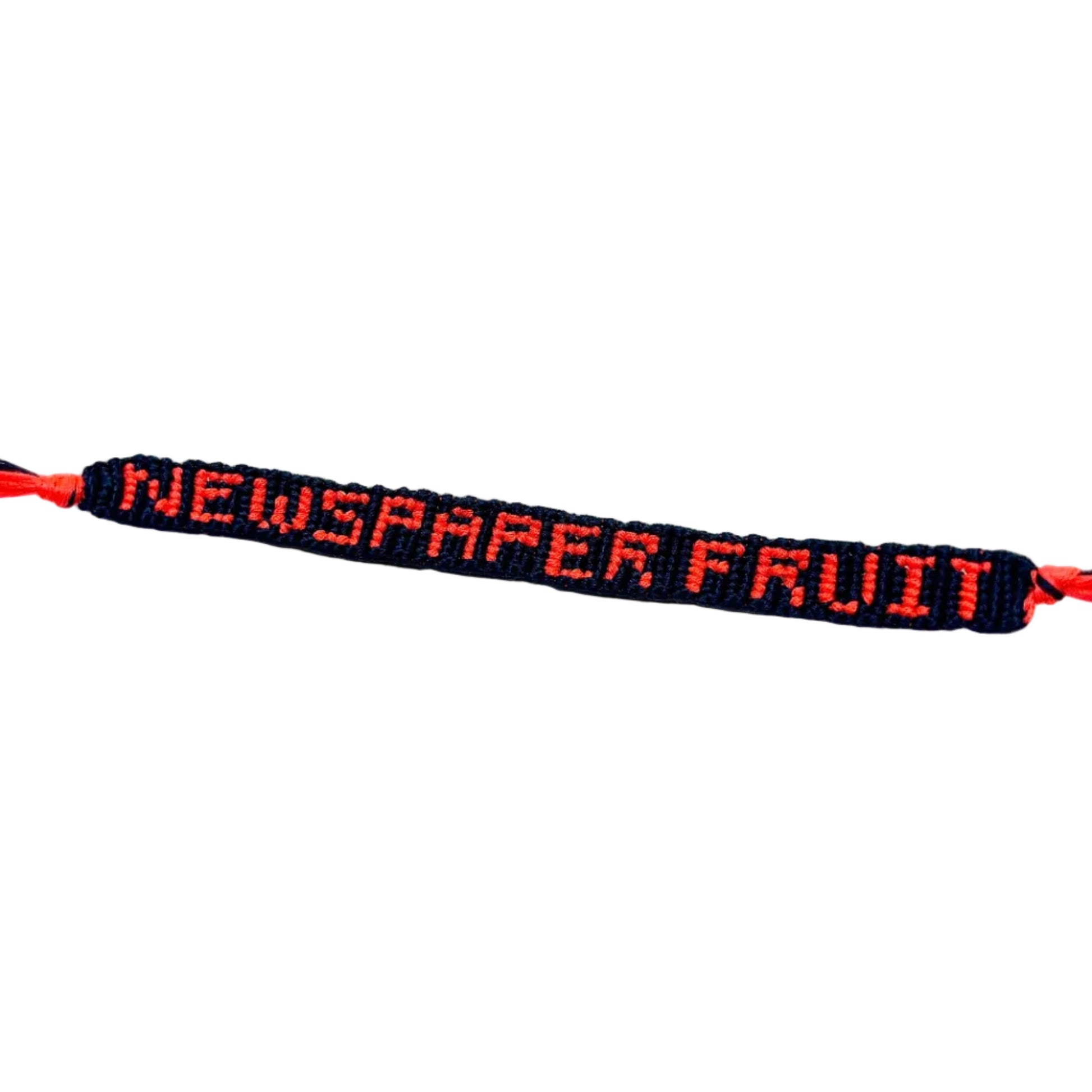 Bracelet with 'NEWSPAPER FRUIT' text on a white background