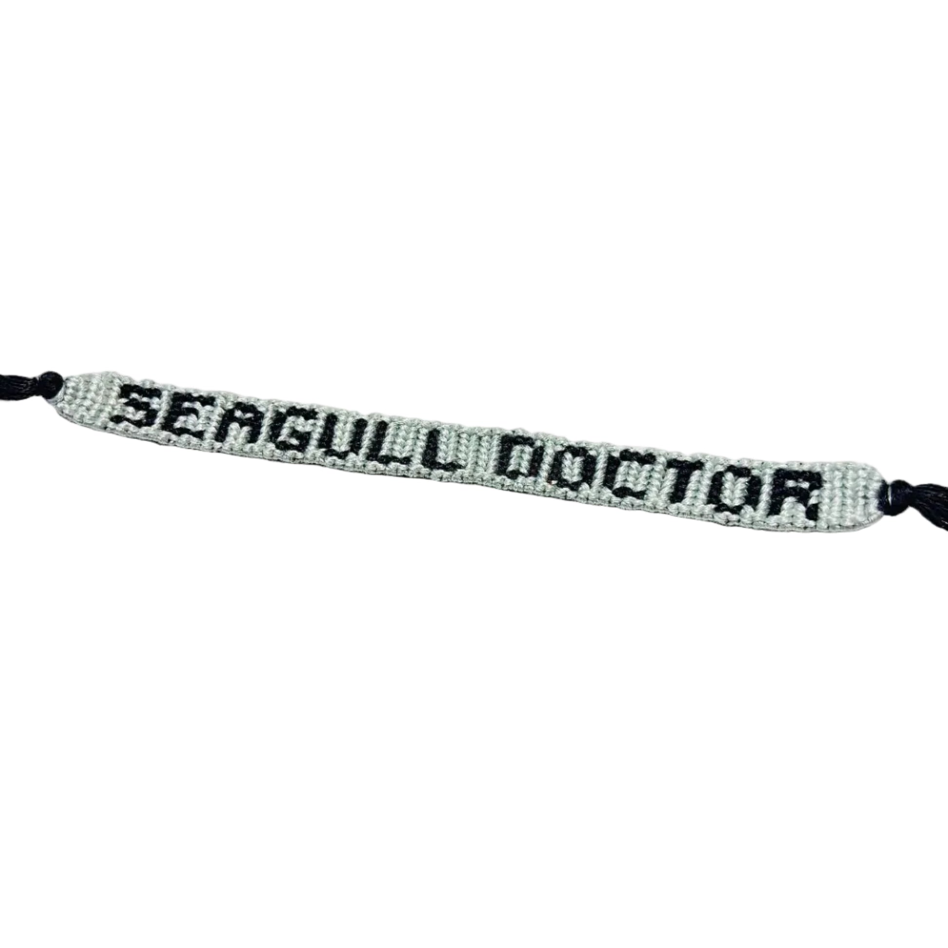 Bracelet with 'SEAGULL DOCTOR' text on a white background