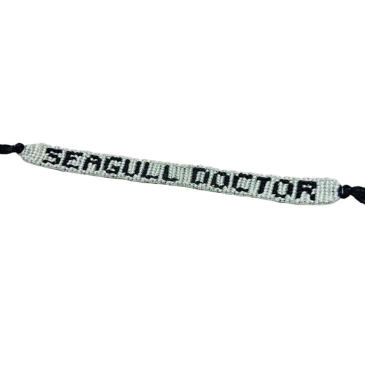 Bracelet with 'SEAGULL DOCTOR' text on a white background